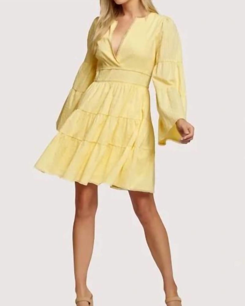Front of a model wearing a size Large Picking Daisies Mini Dress In Butter in Butter by LOST + WANDER. | dia_product_style_image_id:357621